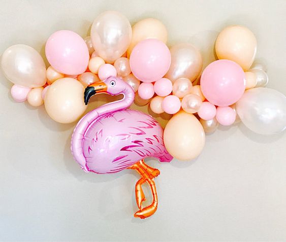 Trend in flamingos and fruit pineapple balloons