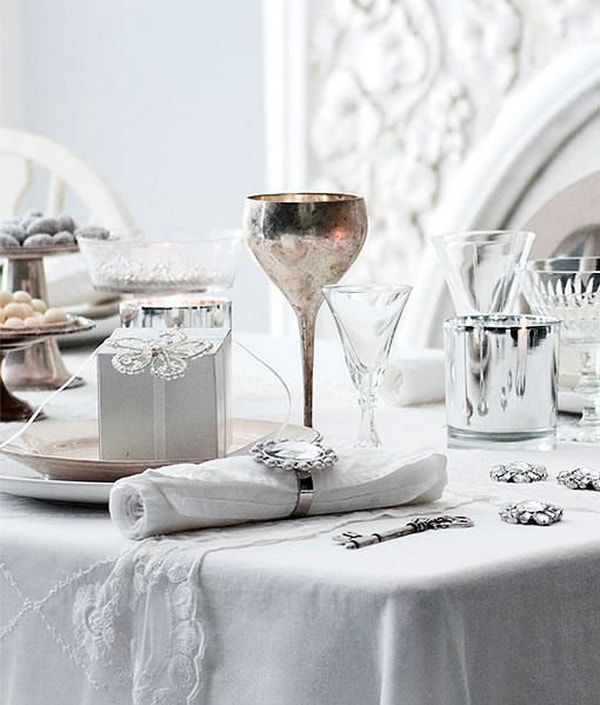 Christmas table decorated in silver colour
