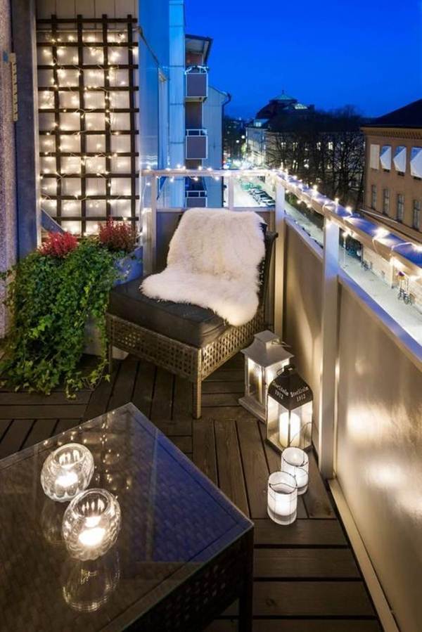 Balcony decorated with candles and garlands of lights