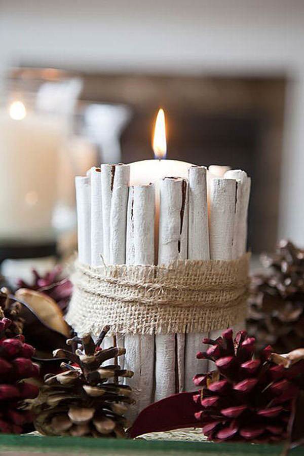 Table centerpiece with candle and cinnamon