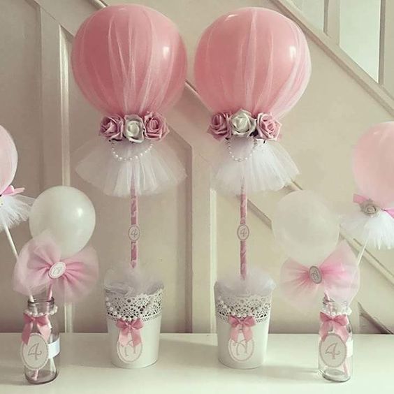 Table centerpieces with balloons and tutus