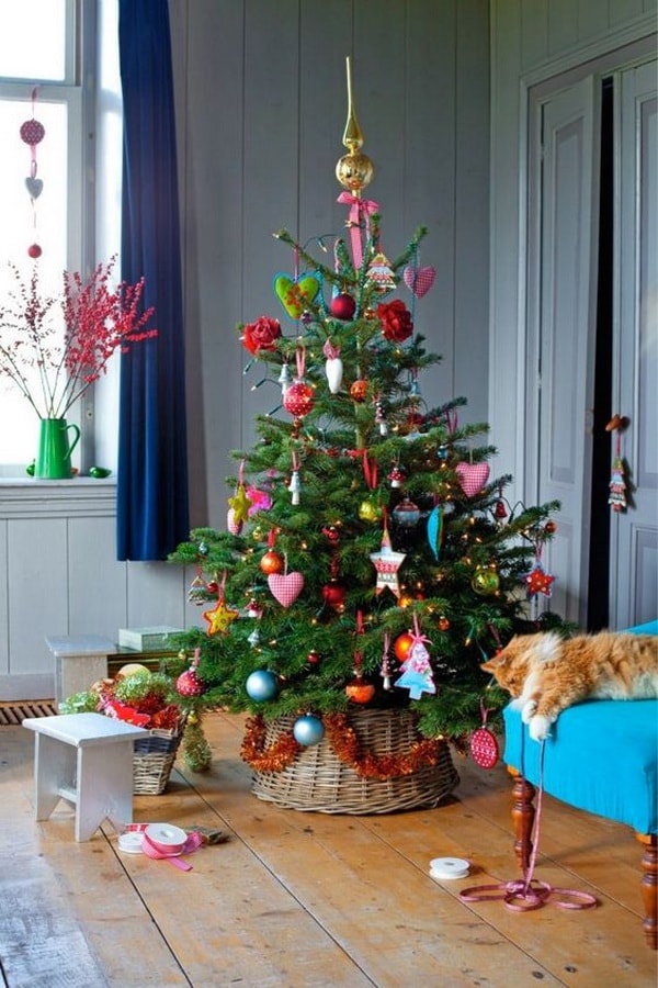 Christmas trees in baskets and decorations of many colors