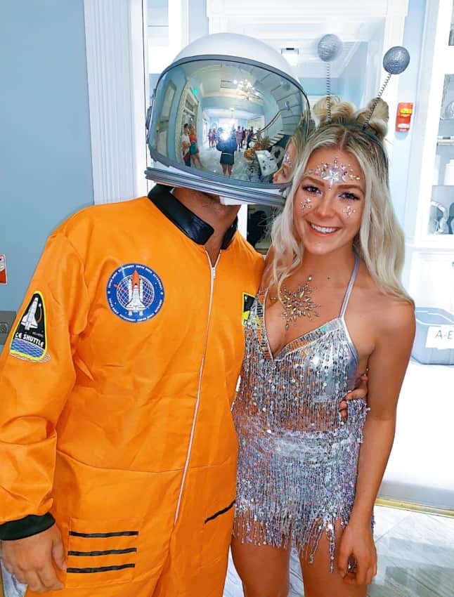 male astronaut costume with alien girlfriend