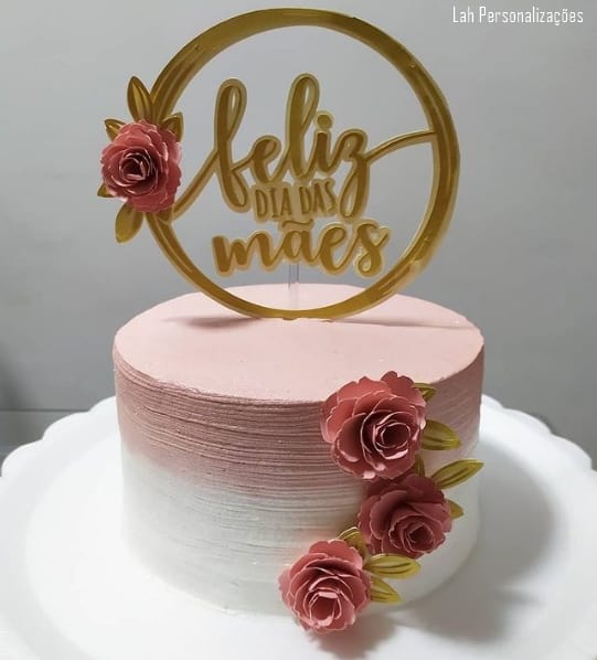 white and pink cake with mothers day top with roses