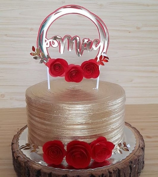 golden cake with mothers day top with roses