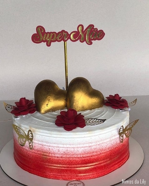 red and white cake with super mae top