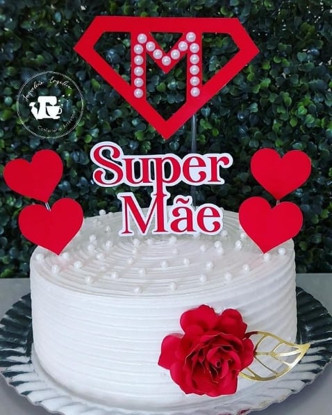 white whipped cream cake with super mae top