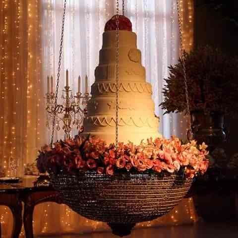 The cake with flowers on a beautiful stand to decorate your wedding