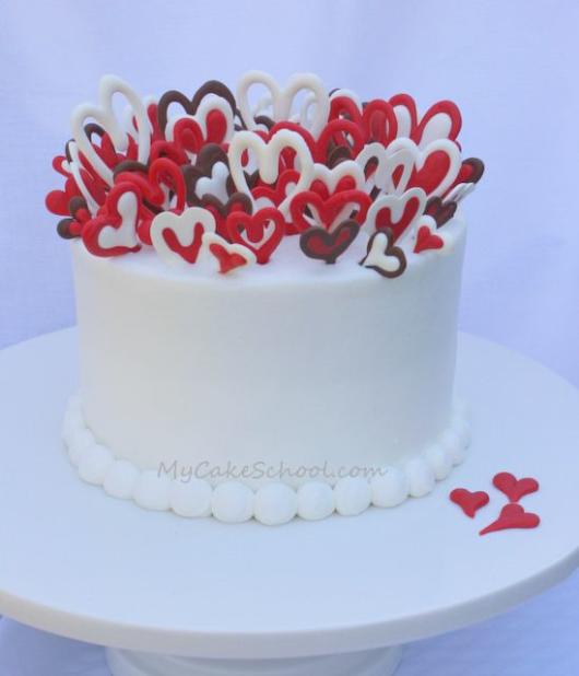 Heart cake with whipped cream: White with chocolate hearts