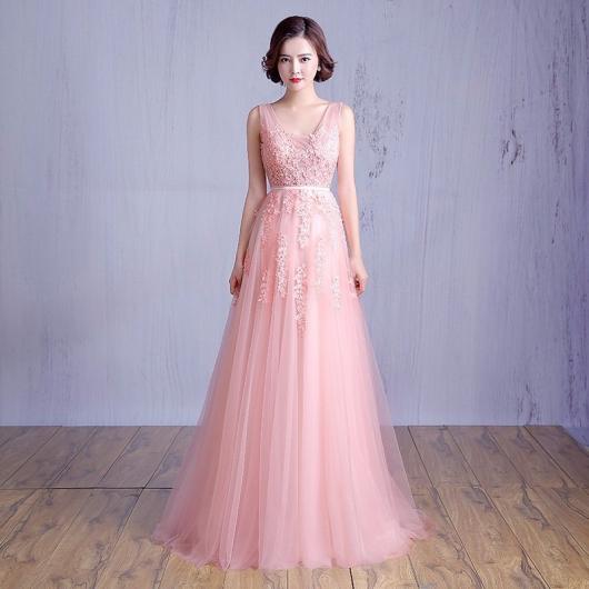 Delicate bridal look with baby pink long dress