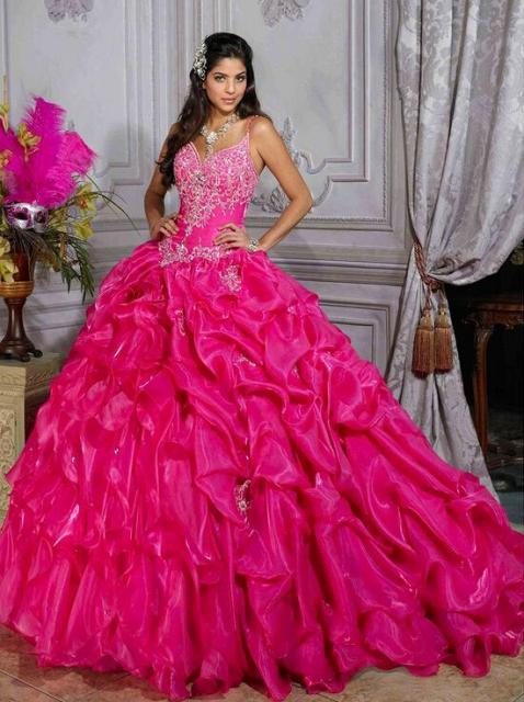 Pink wedding dress with ruffles on the tail and rhinestones