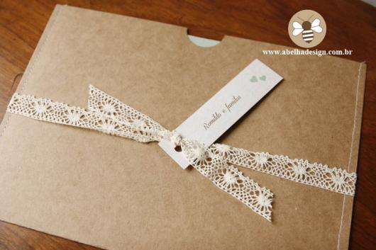 Invitation envelope in kraft paper with lace bow