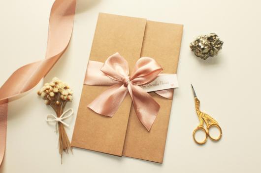 Invitation envelope in kraft paper with ribbon bow