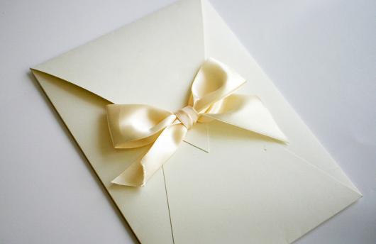 Simple invitation envelope with bow