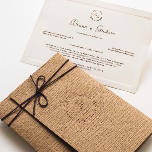 Rustic wedding invitation envelope with waxed wire bow