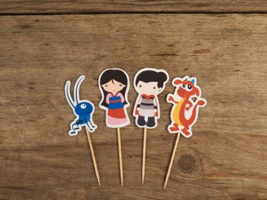 Toppers of the characters in the film Mulan.