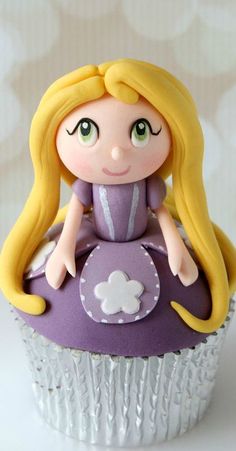 Cupcake with Rapunzel on top.
