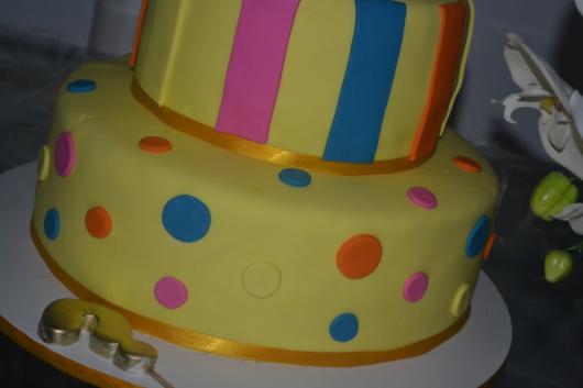 Colorful baby shower cake with polka dots