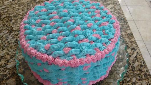 Braided cake with blue and pink whipped cream