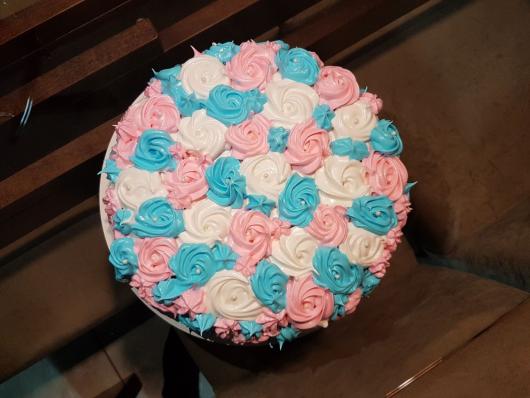 blue and pink white whipped cream cake