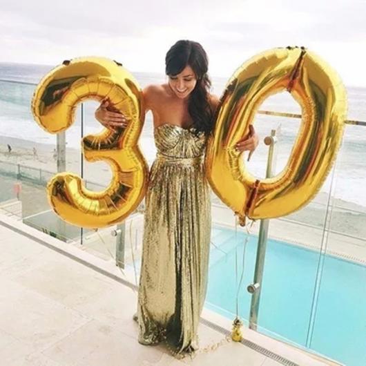 Golden number balloons in photo shoot 
