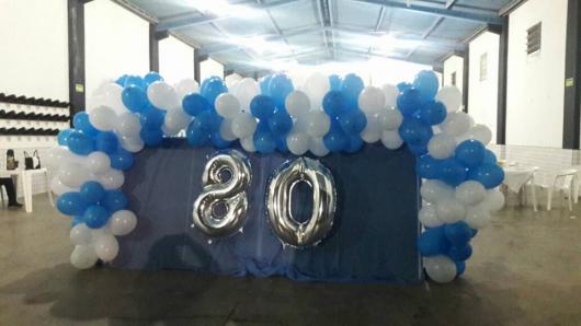 Silver number balloons in white and blue balloon panel