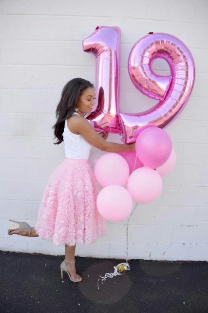 Pink number balloons in photo shoot