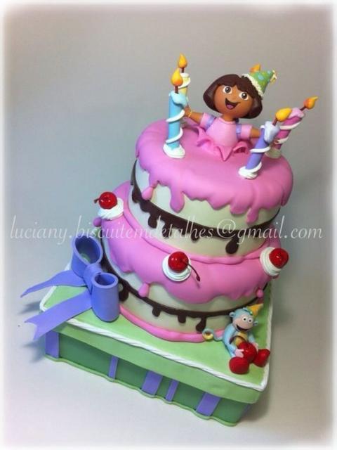 Fake cake by Dora Adventurer, pink and white.