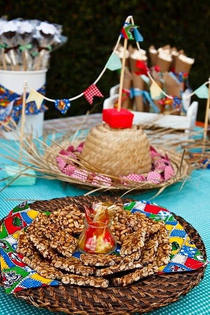 Table with straw hat and sweets.