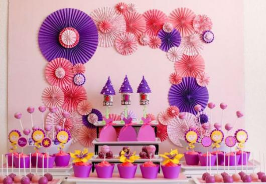 Simple Rapunzel party decorated with homemade party kit and paper flowers on the wall