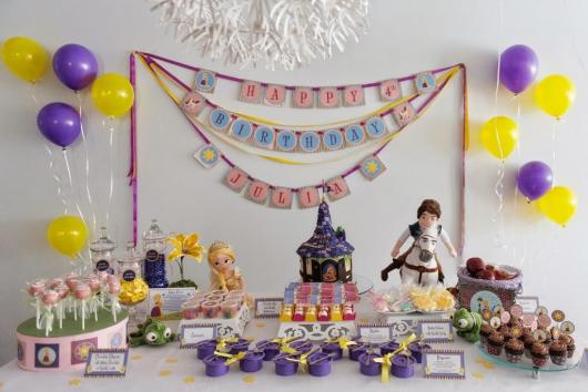 Simple Rapunzel party decorated with table covered with white towel and homemade party kit