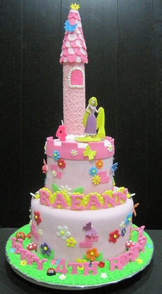 Rapunzel pink cake party with castle tower top