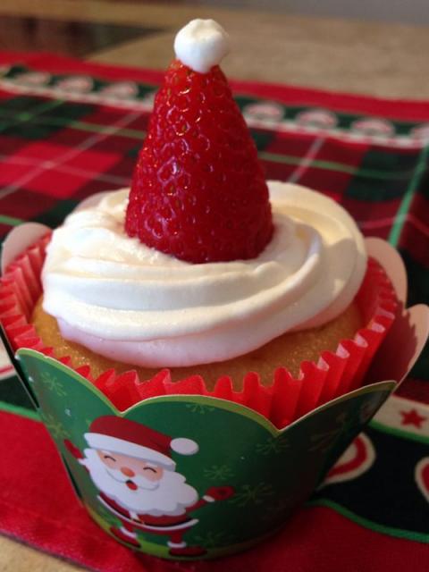 Green wrapper Christmas cupcake with Santa Claus
