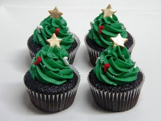 Christmas cupcake decorated with whipped cream and stars