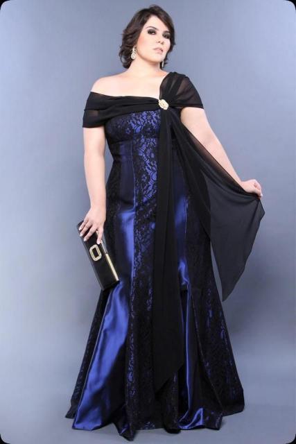 Model wears long, shoulder-to-shoulder, blue dress, mermaid train.