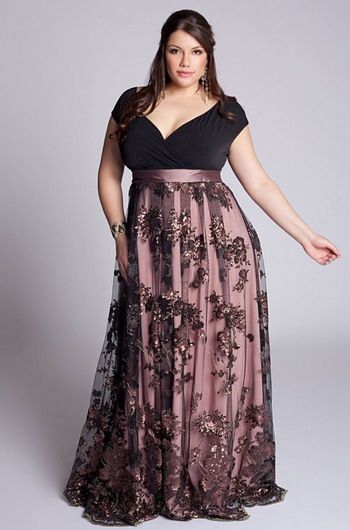 Model wears long plus size dress in shades of black and rose with neckline "V".
