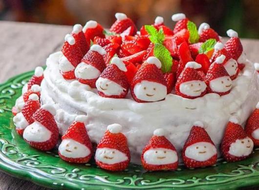 Simple white whipped Christmas cake with strawberries