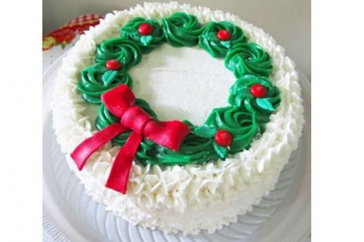 Simple white, red and green whipped cream Christmas cake