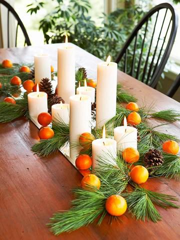 New Year's table decoration with fruit and candles.