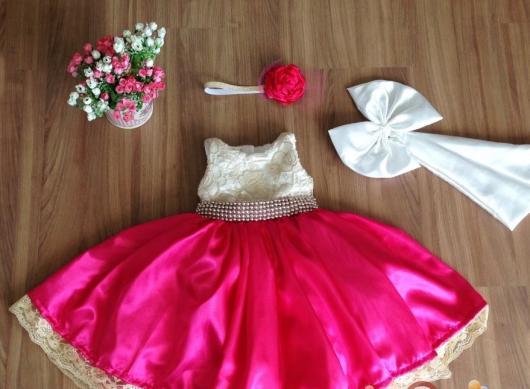 Pink dress with bow and pearl sash