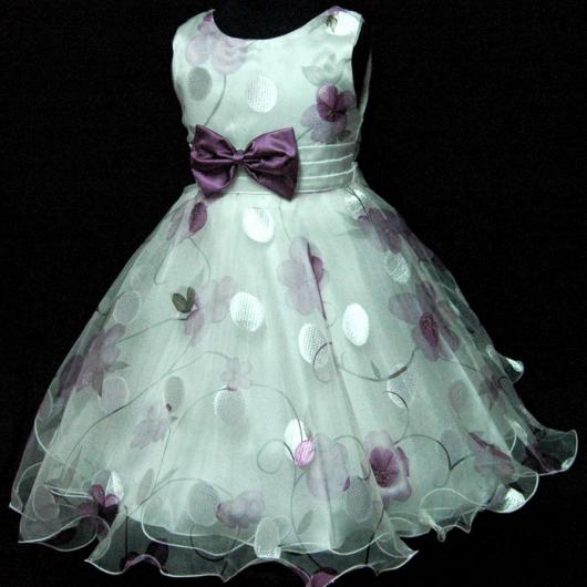 White children's dress with purple bow