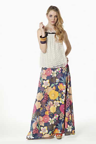 Simple hippie look model with basic white blouse and floral skirt