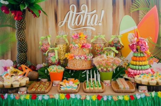 Cake table with Hawaii-inspired food