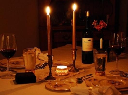 candlelit table with wine