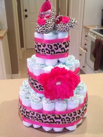 leopard-themed female fake cake, with a flower, leopard print ribbons, and leopard shoes