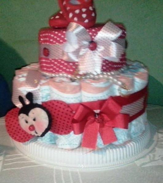 ladybug themed fake cake with red polka dot print and bows