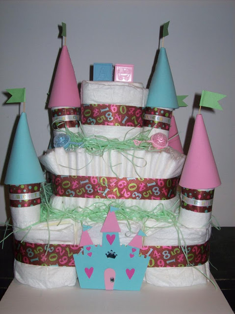 Unisex fake castle cake in pink and blue, with ribbons stamped with numbers