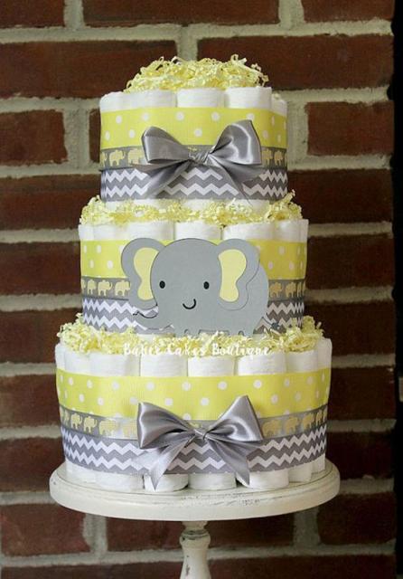 Unisex fake elephant cake with gray bows and gray and yellow ribbons