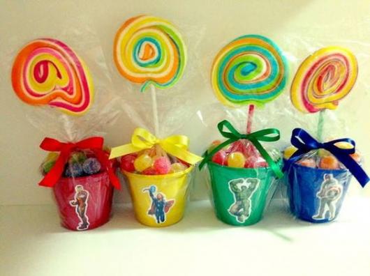 Colorful pots with lollipops and candies.
