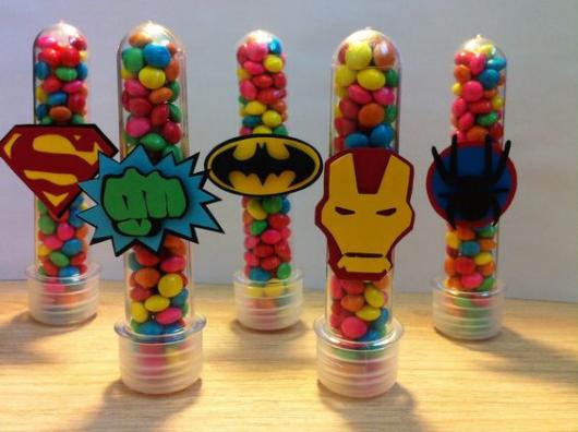 Tubes with Avengers decoration and colorful confetti.